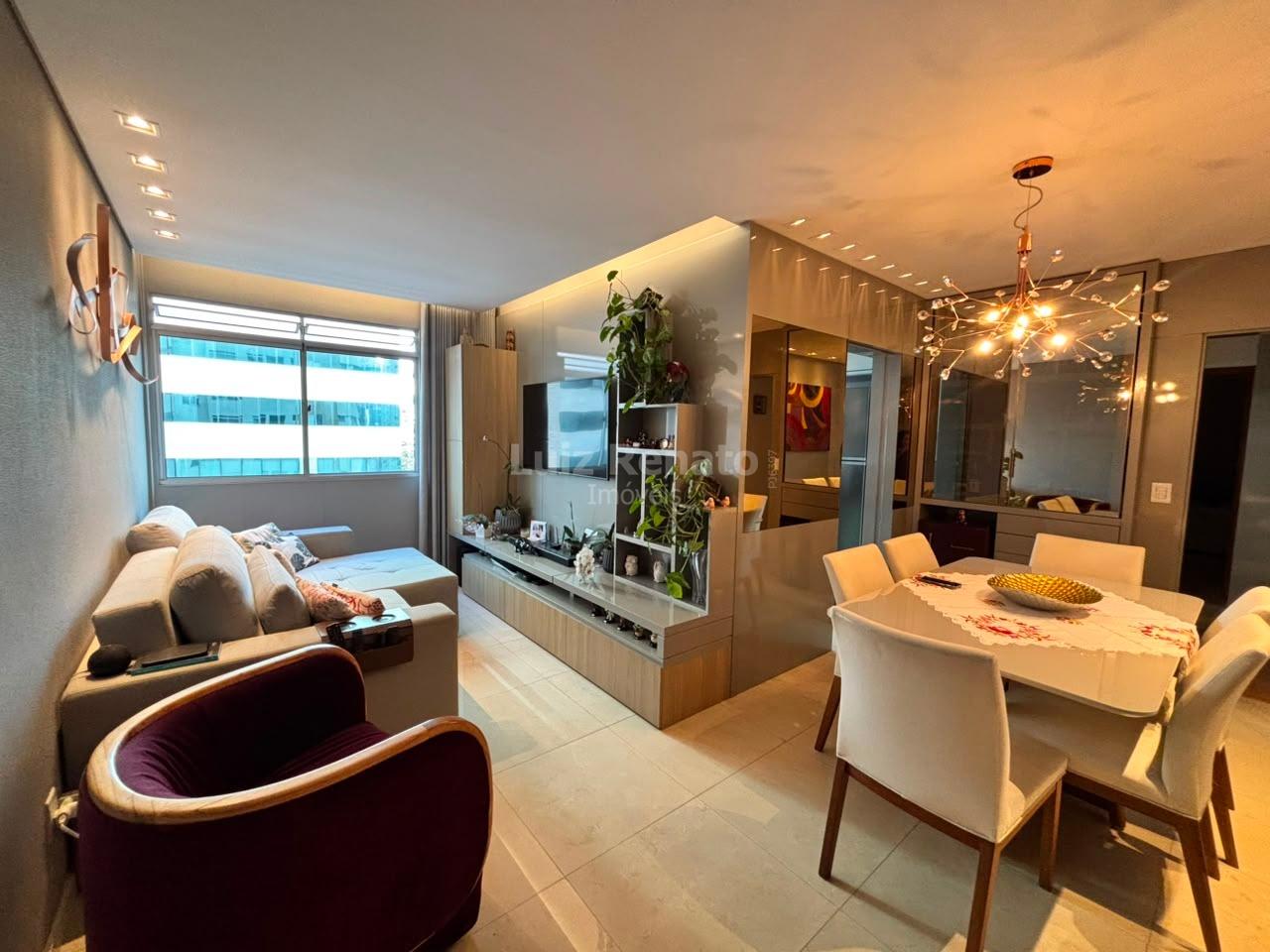 Sala de estar e jantar integradas do apartamento de 2 quartos na Savassi